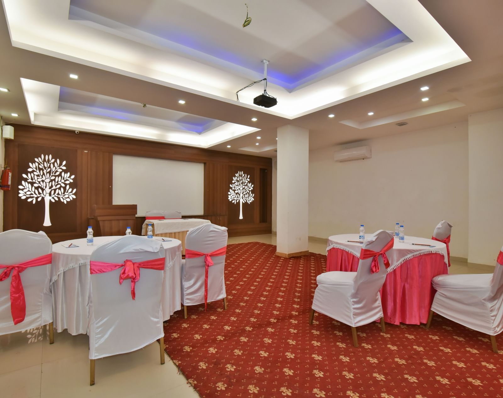 A conference hall with comfortable chairs facing the podium at DLS Highland Resort and Spa, Mussoorie.